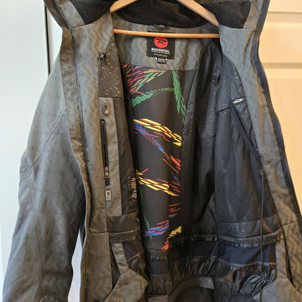 Rossignol Black Jacket with Colorful Inner Design. Brand New Zipper